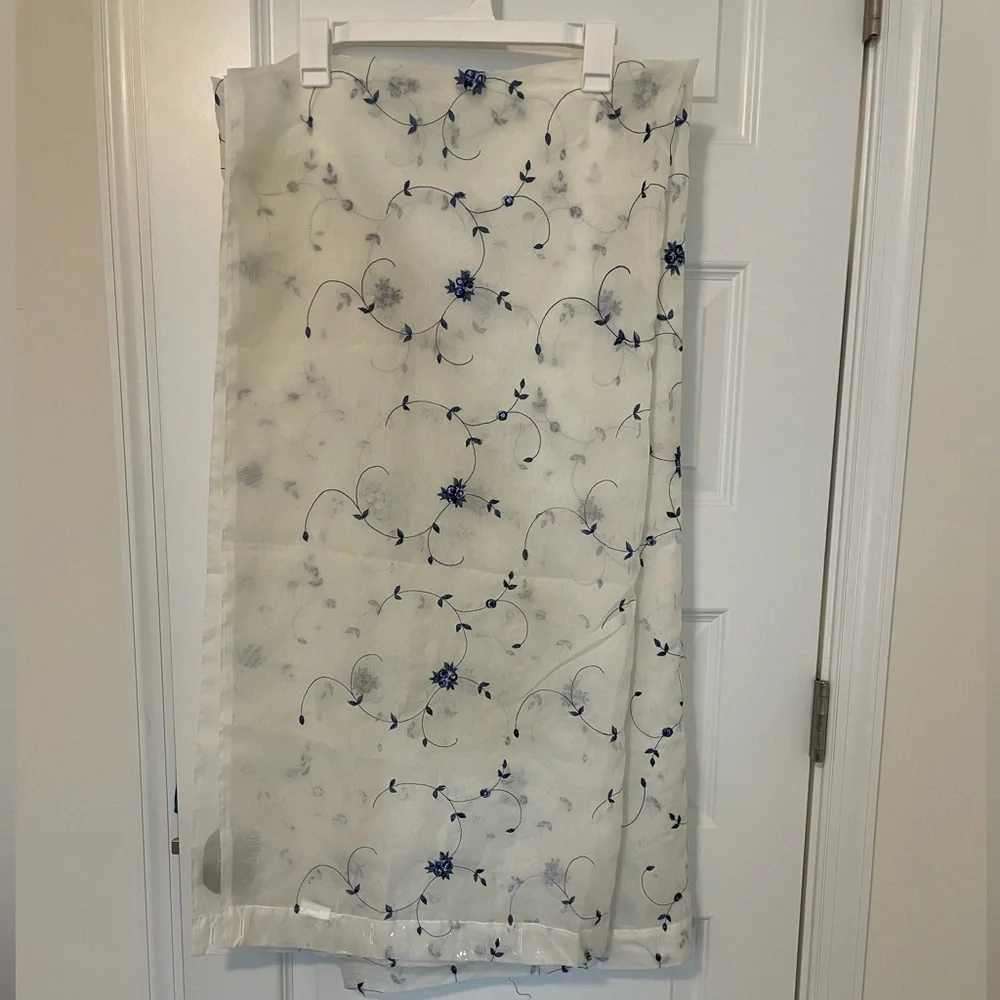 White Sheer Shower Curtains with a pattern delicate blue flowers through out